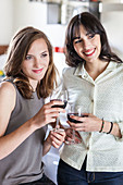 Women drinking red wine