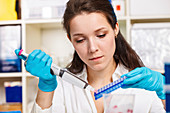 Woman working in microbiology laboratory
