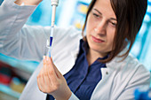 Girl using pipette