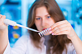 Woman using pipette