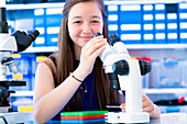 Girl using microscope