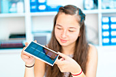 Girl working on solar cell in classroom