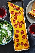 Pumpkin and tomato tart with a spinach salad