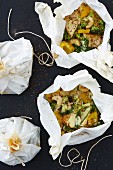 Tofu with coconut, lime and couscous in parchment paper