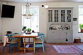 Dining table, blue designer chairs and grey dresser