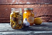 Preserved garlic and lemons in mason jars