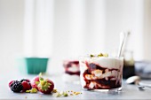 Summer berries yoghurt fools dessert with buckwheat honey