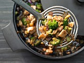 Stir fried chicken with broccoli, walnuts and oyster sauce