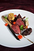 Pigeon étouffé with aubergine, fig and ras el hanout from the 'Heldenplatz' restaurant in Hamburg, Germany