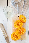 Pressed oranges on a cutting board