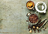 Espresso and coffee beans on vintage background