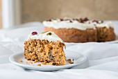 Carrot cake decorated with cranberries and seeds