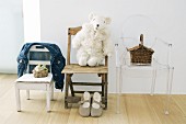 Three different children's chairs, small basket and toy sheep