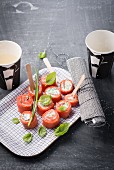 Salmon rolls with fresh cheese and basil