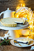 A Christmas poppy seed tart with a slice cut out