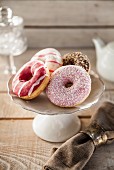 Donuts with different glazes on a cake stand