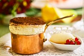 Sweet souffle with cocoa, sorbet and berries