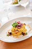 Tagliolini with fresh tomato sauce and olives