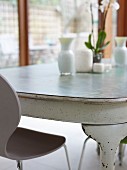 Rustic dining table and plastic chair