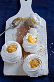 Meringue nests with mango and coconut