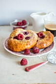 Yeast buns with sour cream and raspberry filling