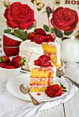 Vanilla and strawberry cake with a slice cut out