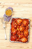 Chicken wings, thighs and drumsticks with barbecue sauce and apricot glaze