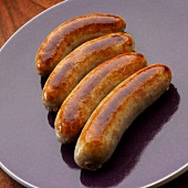 Four English bangers on plate