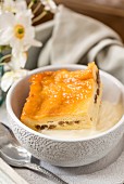 Bread and butter pudding with vanilla sauce