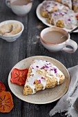Persimmon Rose Scones served with espresso from front view on a rustic gray wood background