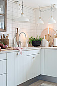 White country-house kitchen with natural accessories