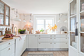 White country-house kitchen decorated with natural accessories