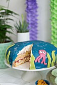 Coconut cream cake with a squid decoration for a maritime themed party