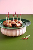 Dates wrapped in bacon with party skewers