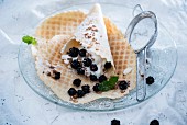 Waffles with vegan vanilla cream, blackberries and crunchy muesli