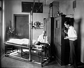 X-ray machine in use, early 20th century