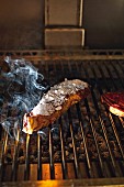 Meat on the grill at the 'Lomo Alto' restaurant in Barcelona, Spain