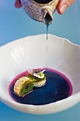 Blue soup with lobster and melon at the 'Alkimia' restaurant in Barcelona, Spain