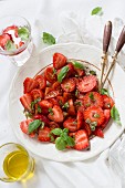 A strawberry salad with olive oil, balsamic and basil