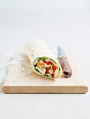A chicken wrap with vegetables