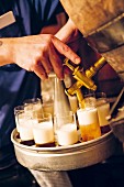 The local Cologne beer Kölsch being tapped from the keg at the 'Lommerzheim' pub and restaurant in Deutz, Cologne, Germany