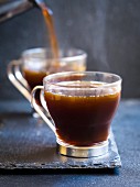 Fresh hot coffee on a dark background