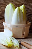 Organic chicory in a wooden basket