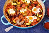 Sausage, kidney bean and courgette bake with eggs