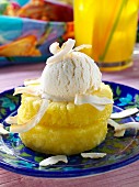 A scoop of coconut ice cream on pineapple rings editorial food