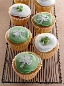 Cupcakes with a green shamrock on top of the white icing