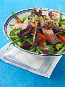 Chargrilled fillet steak strips with vegetable salad honey ginger dressing