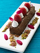 A whole chocolate marquies with raspberries and cream gourmet dessert
