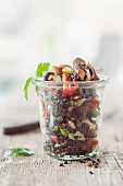 Lentil salad with octopus in a glass jar