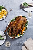 Roast goose with carrots and potatoes